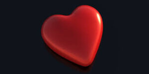 Corazón brillante rojo sobre fondo negro